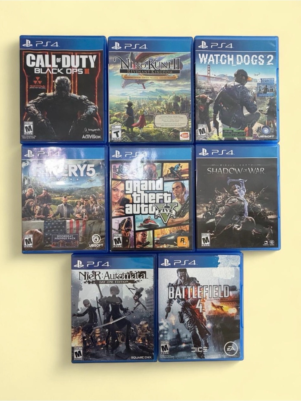 Sony PlayStation 8 Game Bundle - Blue Cases with Multicolored Covers.